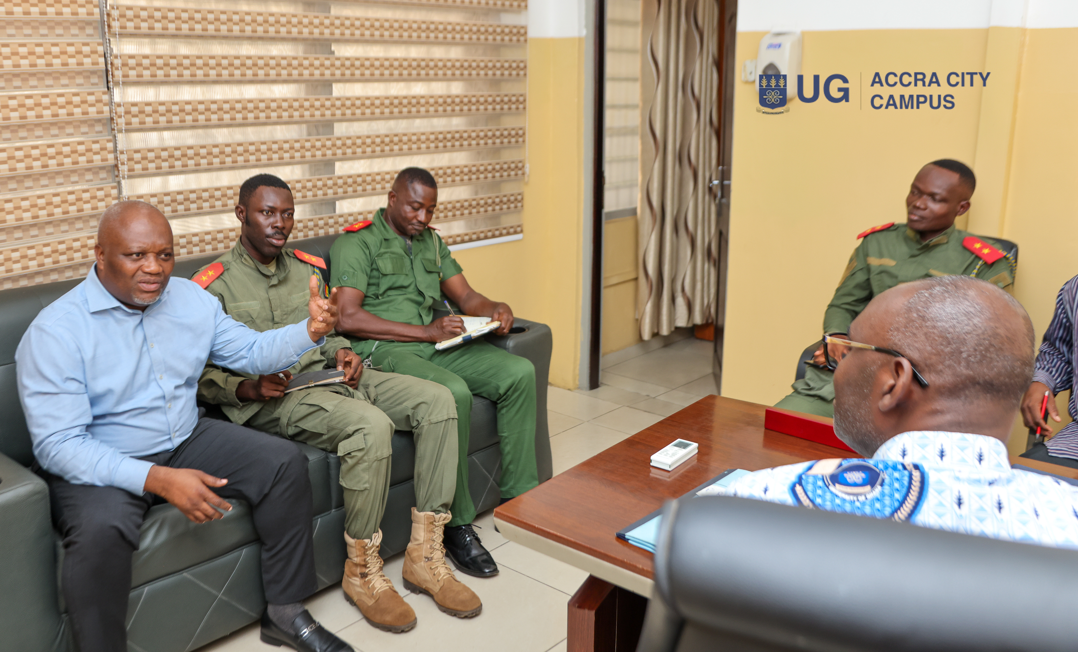 Dr. Amoabeng and his team in a discussion with the Principal.