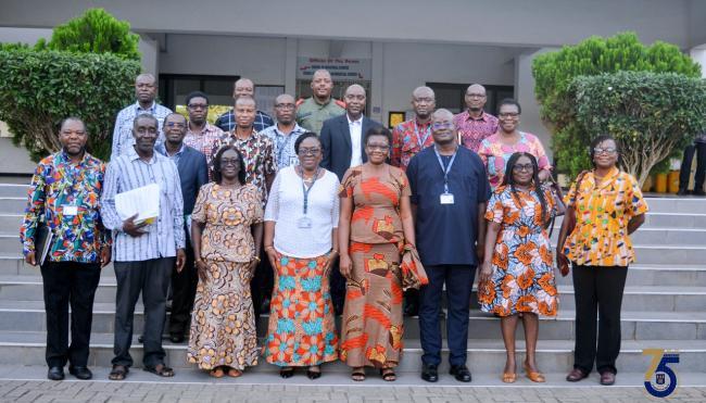 faculty members taking a picture together