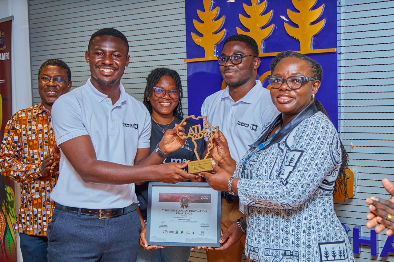 Team members of Fihankra ComTech Limited presenting their award to the Vice-Chancellor